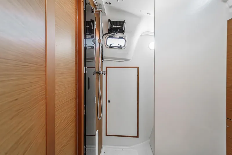 Slide: The Image of Interior of 2022 Jeanneau Sun Odyssey 349 yacht, featuring a modern bathroom design. - 27