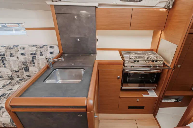 Slide: The Image of 2022 Jeanneau Sun Odyssey 349 yacht kitchen with modern sink and stove. - 35