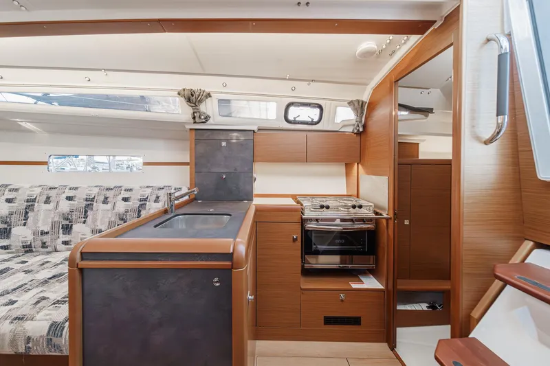 Slide: The Image of 2022 Jeanneau Sun Odyssey 349 interior with modern kitchen and seating area. - 36