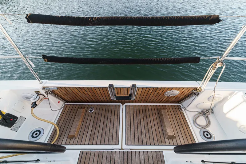 Slide: The Image of Jeanneau Sun Odyssey 349 (2022) yacht deck with wooden flooring and water view. - 43