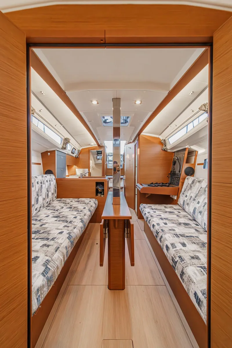 Slide: The Image of Interior of 2022 Jeanneau Sun Odyssey 349 sailboat, featuring cozy seating and modern design. - 9