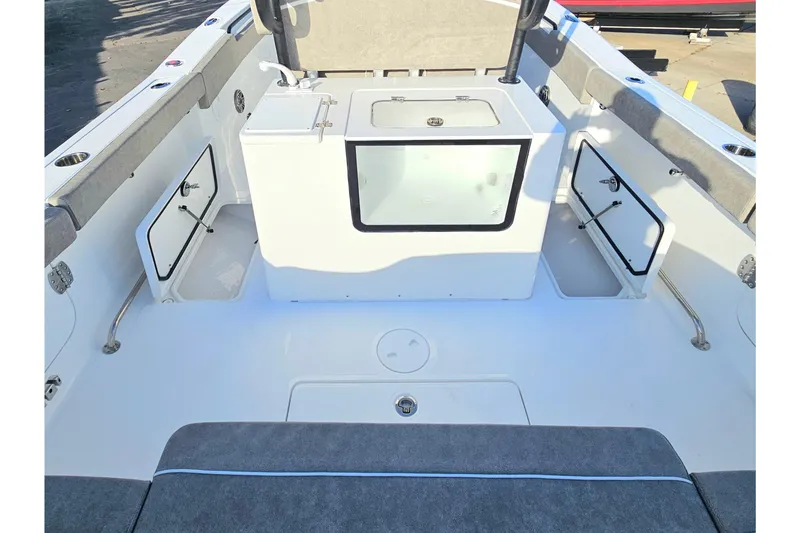 Slide: The Image of 2026 Sea Hunt Ultra 285 SE boat interior with storage compartments and seating. - 10