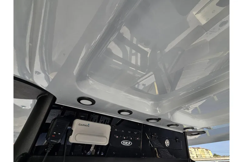 Slide: The Image of 2026 Sea Hunt Ultra 285 SE boat interior with Garmin electronics and sleek design. - 17