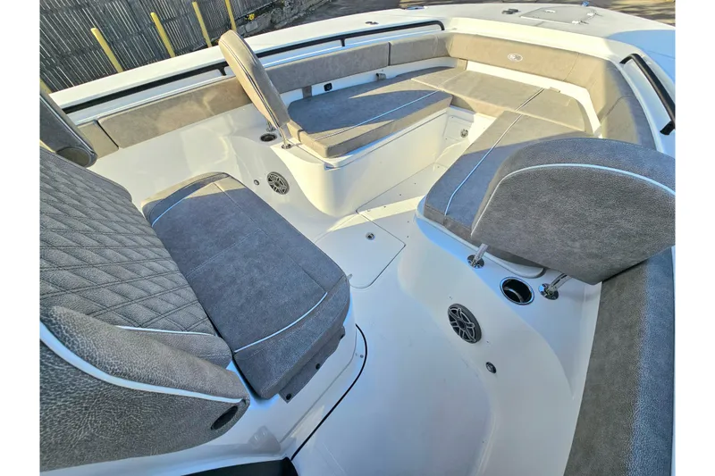 Slide: The Image of 2026 Sea Hunt Ultra 285 SE boat interior with cushioned seating and modern design. - 22