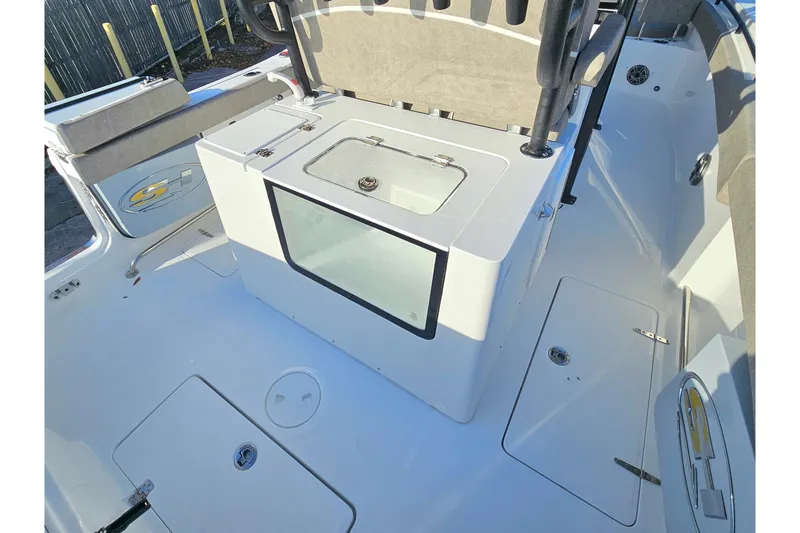 Slide: The Image of 2026 Sea Hunt Ultra 285 SE boat interior with seating and storage compartments. - 9