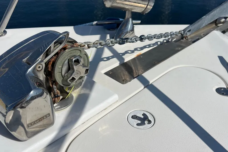 Slide: The Image of Anchor chain mechanism on a 2000 Monterey 302 Cruiser boat deck. - 15