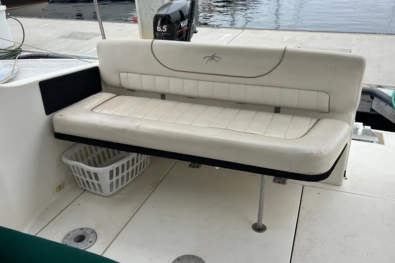 Slide: The Image of White seating on a 2000 Monterey 302 Cruiser boat, dockside view. - 25