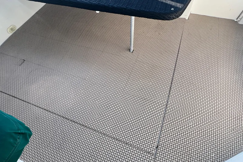 Slide: The Image of Interior flooring of a 2000 Monterey 302 Cruiser boat with textured design. - 29