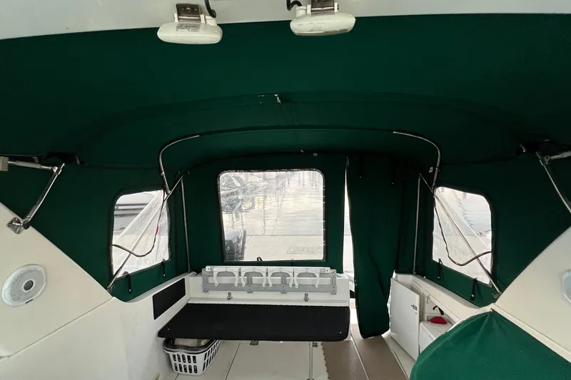 Slide: The Image of Interior view of 2000 Monterey 302 Cruiser with green canopy and seating area. - 47