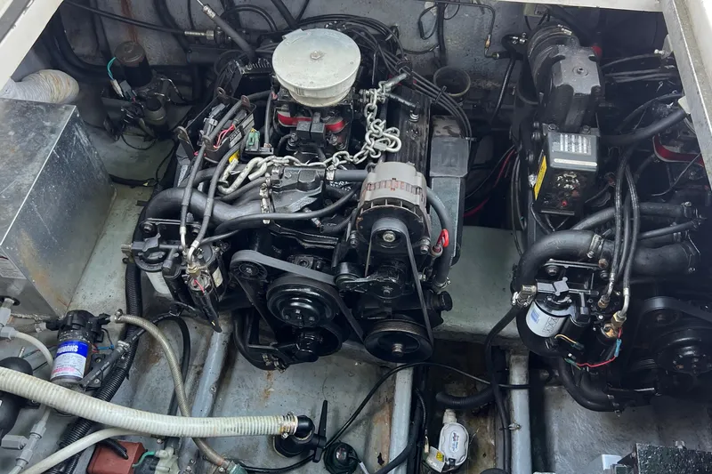 Slide: The Image of Engine compartment of a 2000 Monterey 302 Cruiser, showcasing mechanical components and wiring. - 50