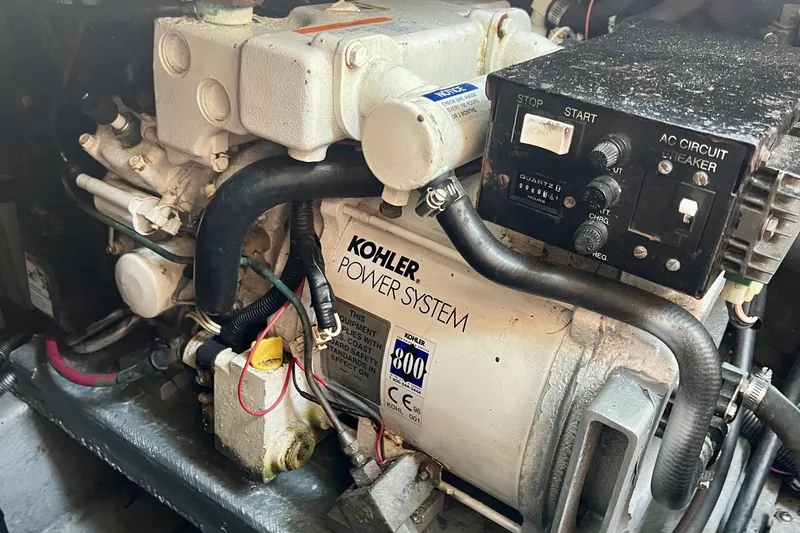 Slide: The Image of Engine compartment of a 2000 Monterey 302 Cruiser with Kohler power system. - 52