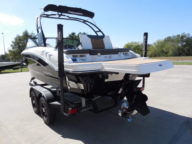 Slide: The Image of The image shows a 2026 Chaparral GTS 1 boat on a trailer, ready for use. - 5