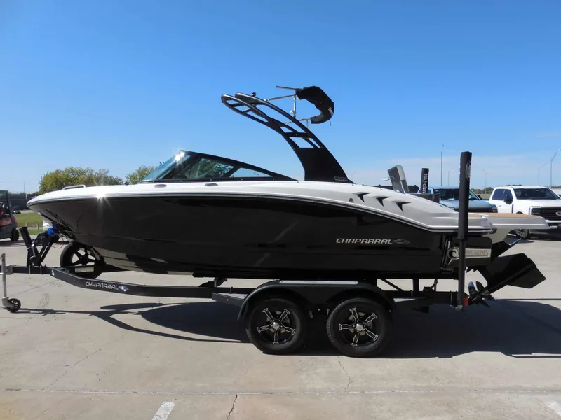 Slide: The Image of 2026 Chaparral GTS 1 on a trailer, featuring sleek design and black hull. - 6