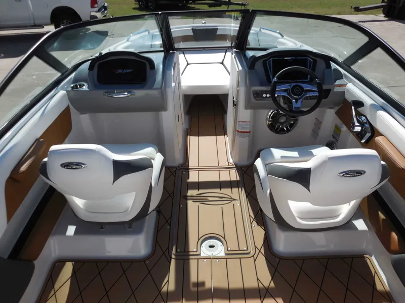 Slide: The Image of Interior view of a modern boat with two white seats and a sleek dashboard. - 13