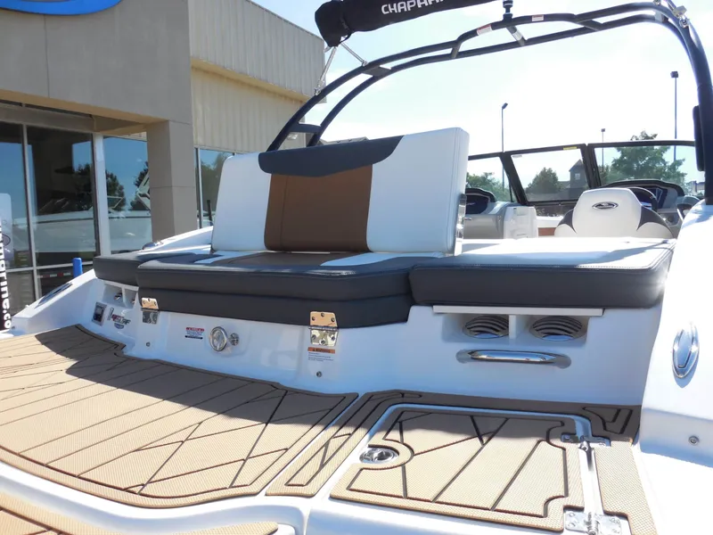 Slide: The Image of The image shows the rear of a 2026 Chaparral GTS 1 boat with cushioned seating. - 11
