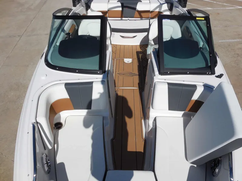 Slide: The Image of The image shows the cockpit of a Chaparral GTS 1 boat with modern seating and an open deck. - 19