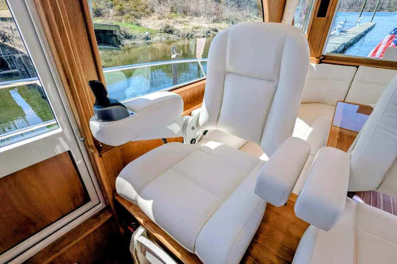 Slide: The Image of Luxurious interior of 2026 Sabre 45 Salon Express yacht with plush white seating. - 11