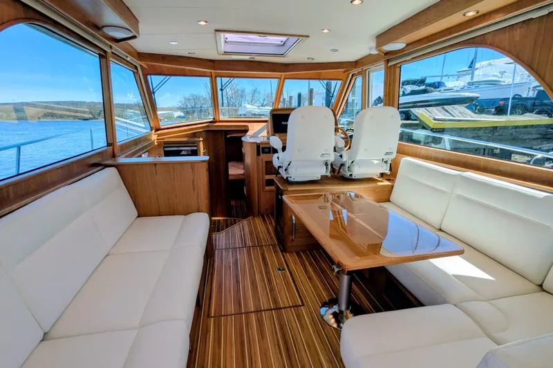 Slide: The Image of Luxurious interior of 2026 Sabre 45 Salon Express yacht with elegant seating and wood finishes. - 12