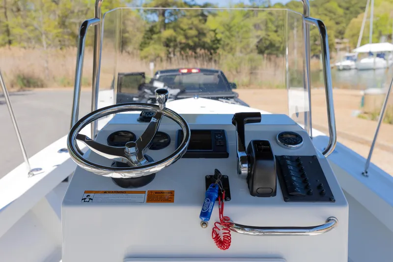 Slide: The Image of Steering console of a 2017 Parker 1801 Center Console boat. - 2
