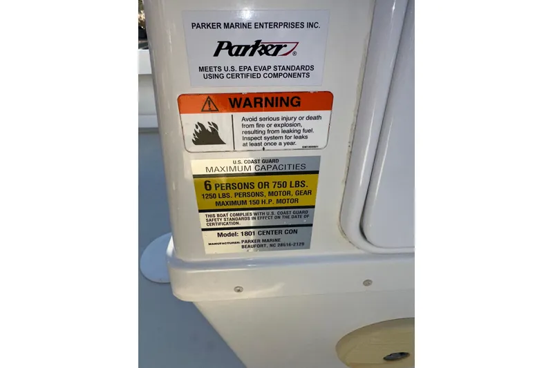 Slide: The Image of Warning label on 2017 Parker 1801 Center Console boat, detailing safety and capacity limits. - 36