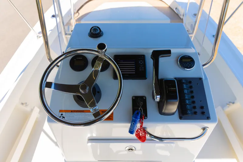 Slide: The Image of Control console of a 2017 Parker 1801 Center Console boat. - 7
