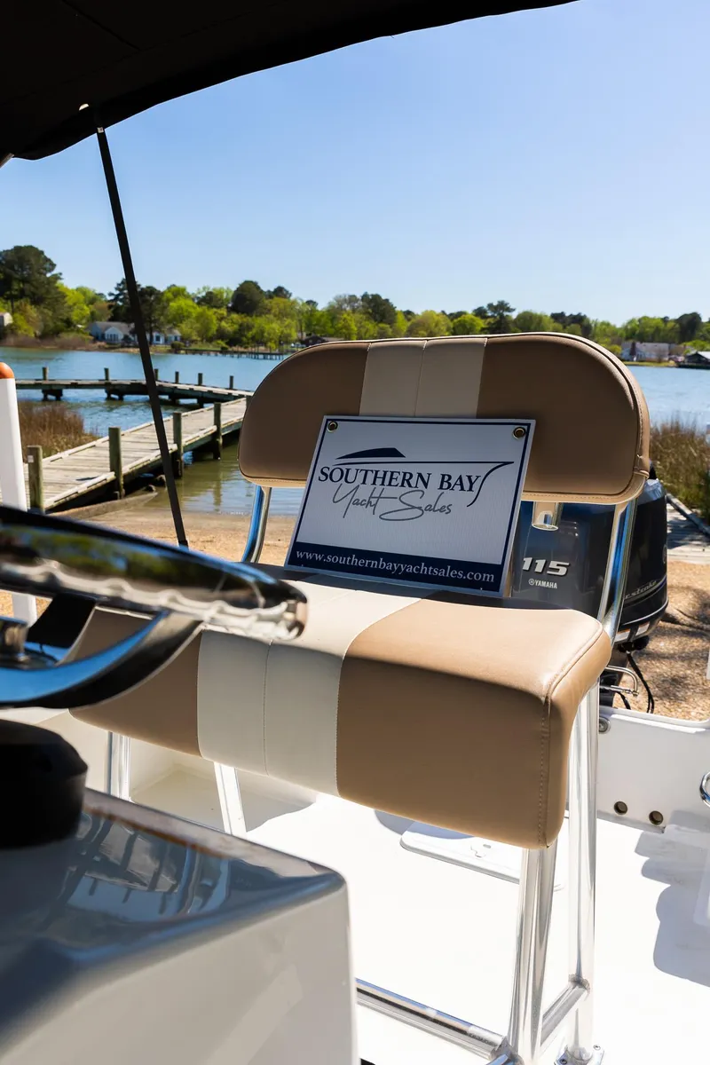 Slide: The Image of Parker 1801 Center Console boat, 2017, docked at sunny waterfront. - 9