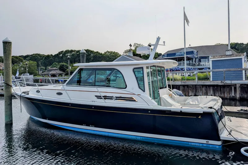 The Image of 2027 Back Cove 372 yacht docked at marina, featuring sleek design and modern amenities. - 0