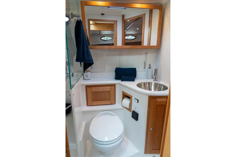 Slide: The Image of Modern bathroom in 2027 Back Cove 372 yacht, featuring sleek fixtures and wooden accents. - 19