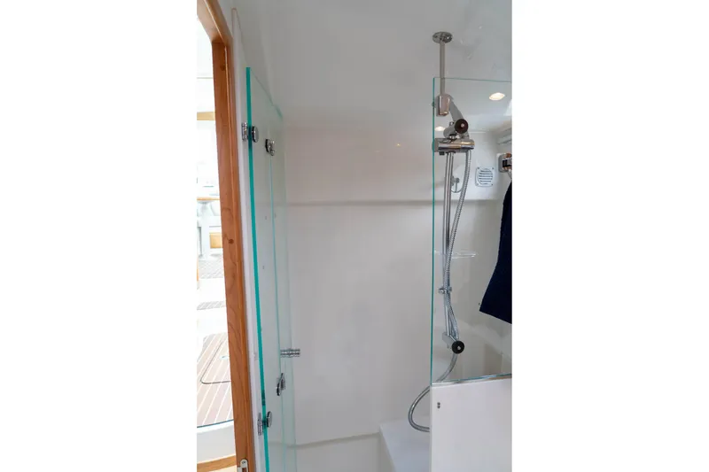 Slide: The Image of Shower area in 2027 Back Cove 372 yacht with glass door and modern fixtures. - 22