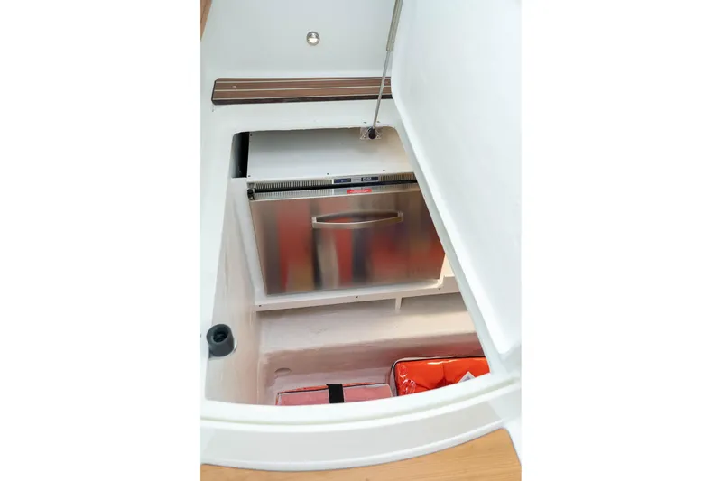 Slide: The Image of Storage compartment with stainless steel drawer in 2027 Back Cove 372 boat. - 23