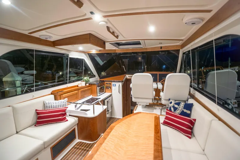 Slide: The Image of Luxurious interior of 2027 Back Cove 372 yacht with elegant seating and modern helm. - 5