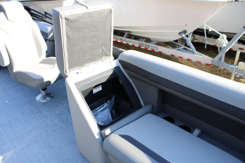 Slide: The Image of Interior of 2026 Premier 200 Sunscape RE boat with open storage compartment. - 11