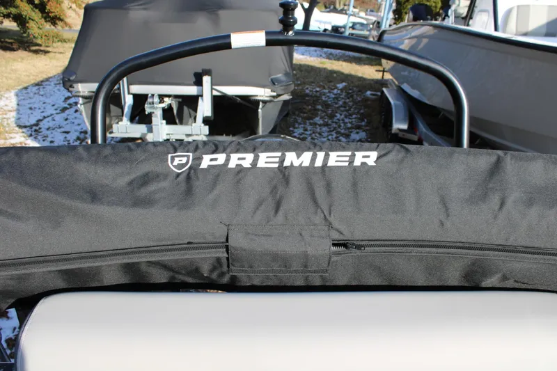 Slide: The Image of 2026 Premier 200 Sunscape RE boat cover with logo, outdoor setting. - 3