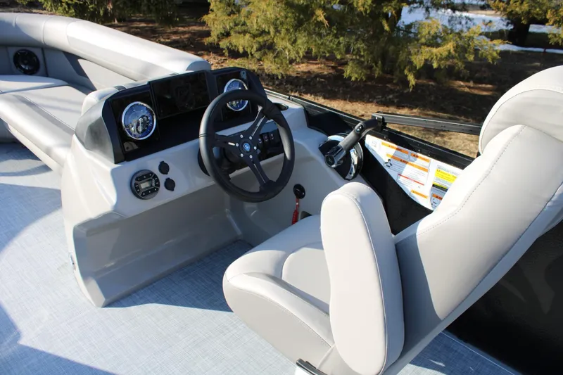 Slide: The Image of 2026 Premier 200 Sunscape RE boat interior with steering wheel and seating. - 6