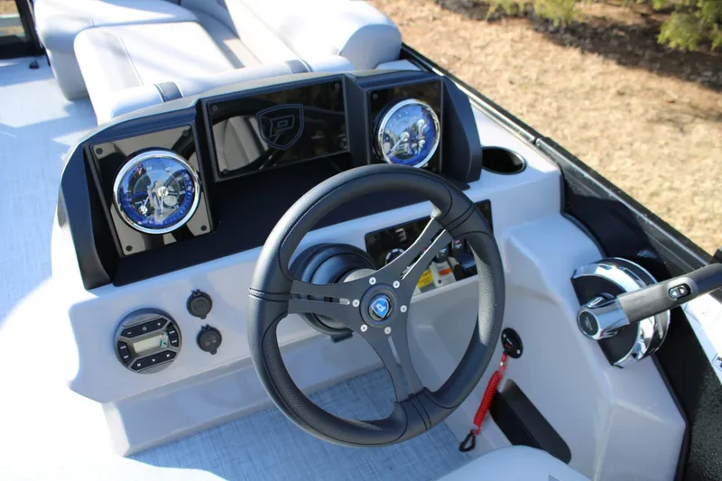 Slide: The Image of Steering console of 2026 Premier 200 Sunscape RE boat with modern controls and gauges. - 7