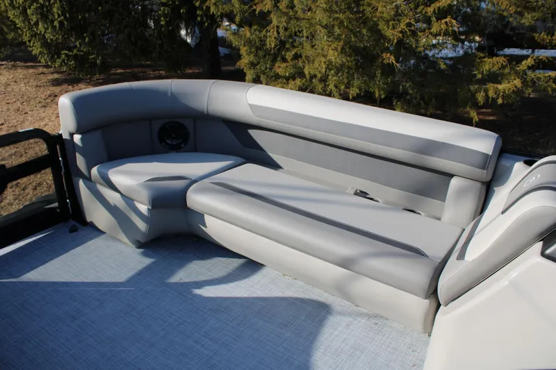 Slide: The Image of Premier 200 Sunscape RE 2026 boat interior with gray seating and speaker. - 9