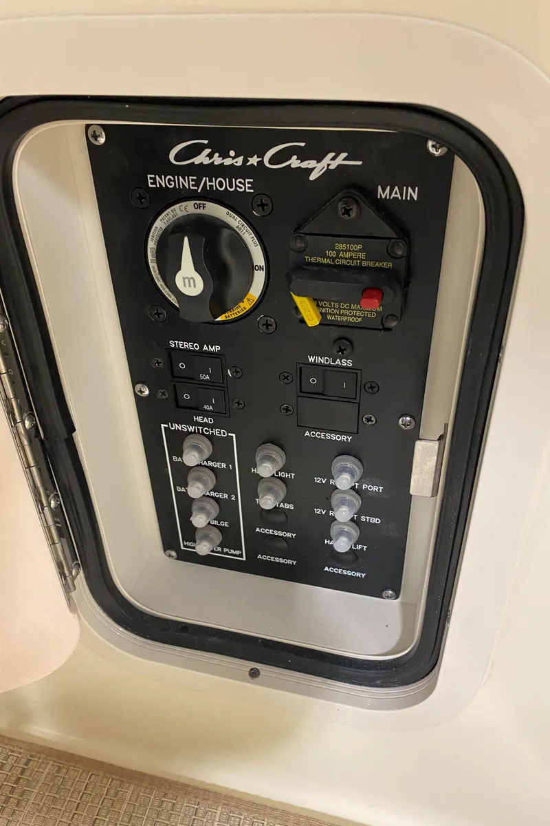 Slide: The Image of Control panel of 2025 Chris-Craft Launch 28 GT boat, featuring engine and accessory switches. - 14