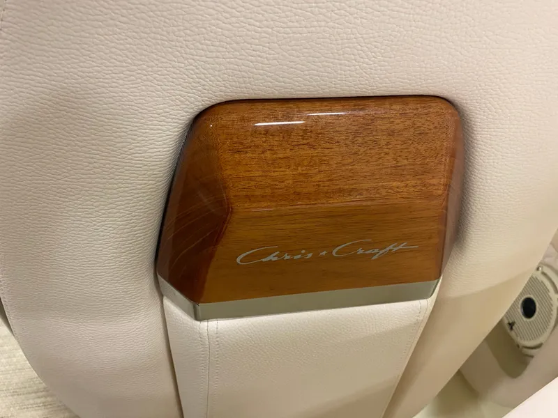 Slide: The Image of 2025 Chris-Craft Launch 28 GT interior detail with wood accent and logo. - 26