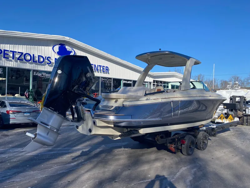 Slide: The Image of 2025 Chris-Craft Launch 28 GT boat on trailer at dealership. - 3