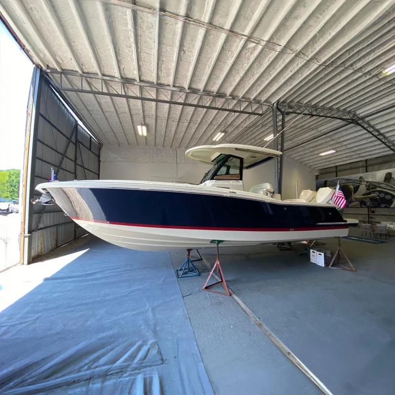 The Image of 2026 Chris-Craft Catalina 28 boat in a spacious indoor storage facility. - 0