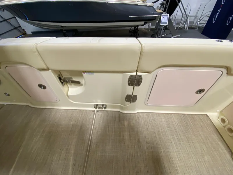 Slide: The Image of 2026 Chris-Craft Catalina 28 interior detail showcasing storage compartments and deck flooring. - 10