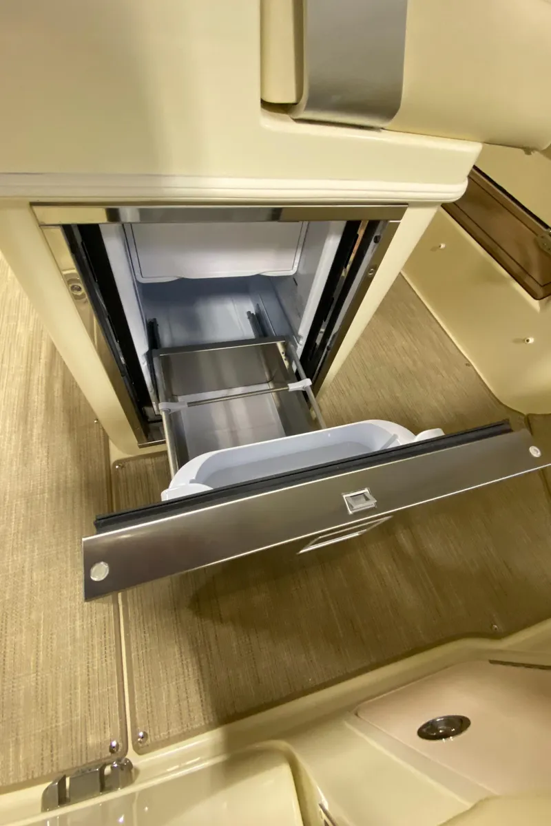 Slide: The Image of 2026 Chris-Craft Catalina 28 interior with open drawer, showcasing sleek design and functionality. - 15