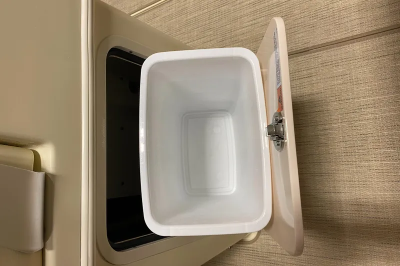 Slide: The Image of Open storage compartment on 2026 Chris-Craft Catalina 28 boat. - 16