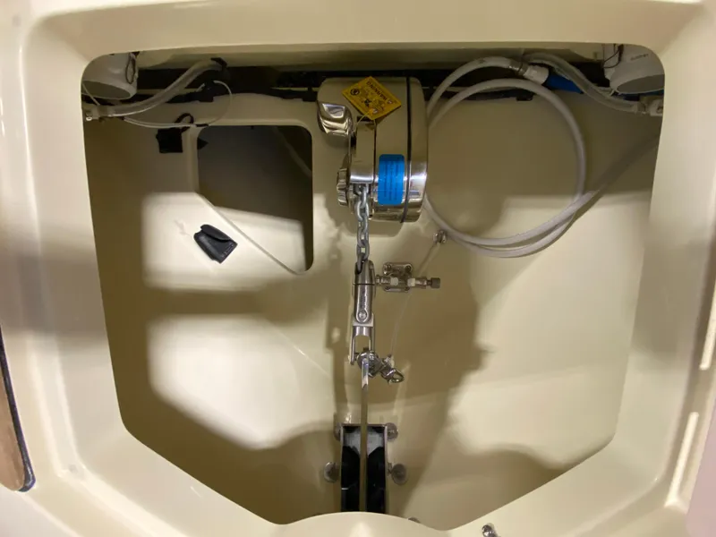 Slide: The Image of Anchor compartment of 2026 Chris-Craft Catalina 28 boat, featuring chain and winch system. - 20