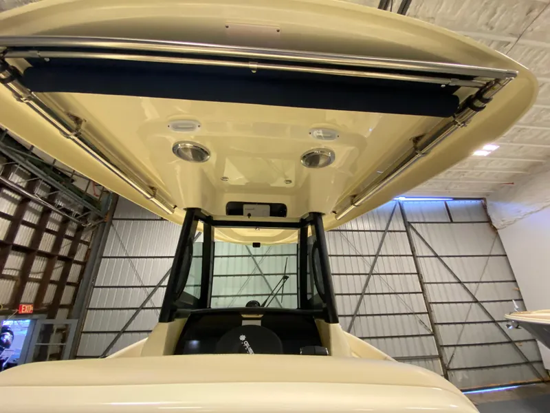 Slide: The Image of 2026 Chris-Craft Catalina 28 boat interior with overhead view in a warehouse setting. - 24