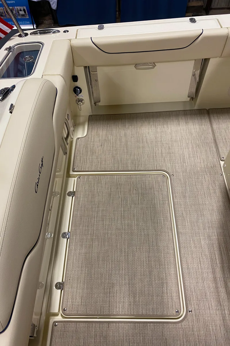 Slide: The Image of 2026 Chris-Craft Catalina 28 interior with beige seating and flooring. - 7