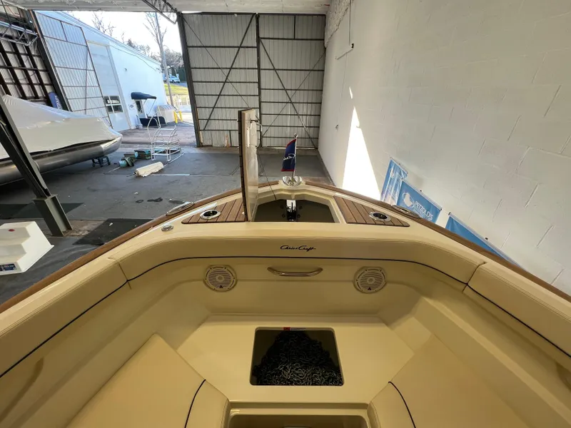 Slide: The Image of 2024 Chris-Craft Calypso 28 boat interior in a storage facility. - 14