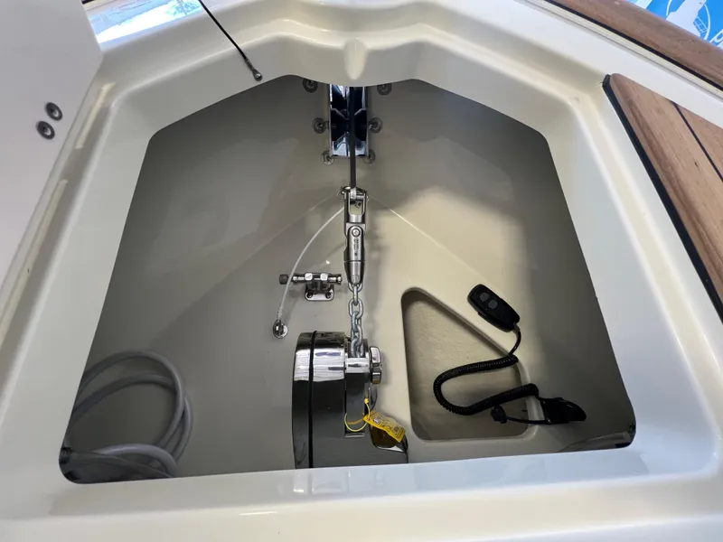 Slide: The Image of 2024 Chris-Craft Calypso 28 anchor locker with chain and rope. - 15
