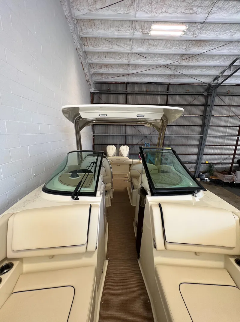 Slide: The Image of 2024 Chris-Craft Calypso 28 boat in a storage facility. - 33