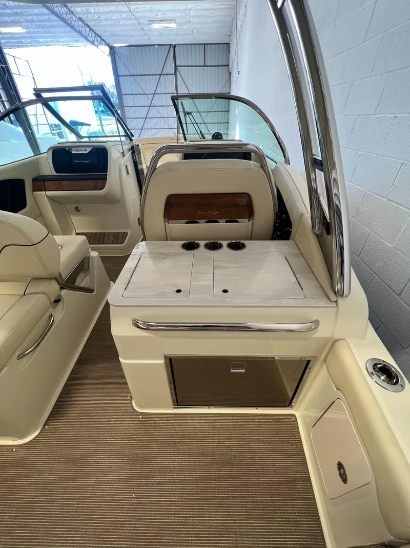 Slide: The Image of 2024 Chris-Craft Calypso 28 interior with seating and storage compartments. - 37